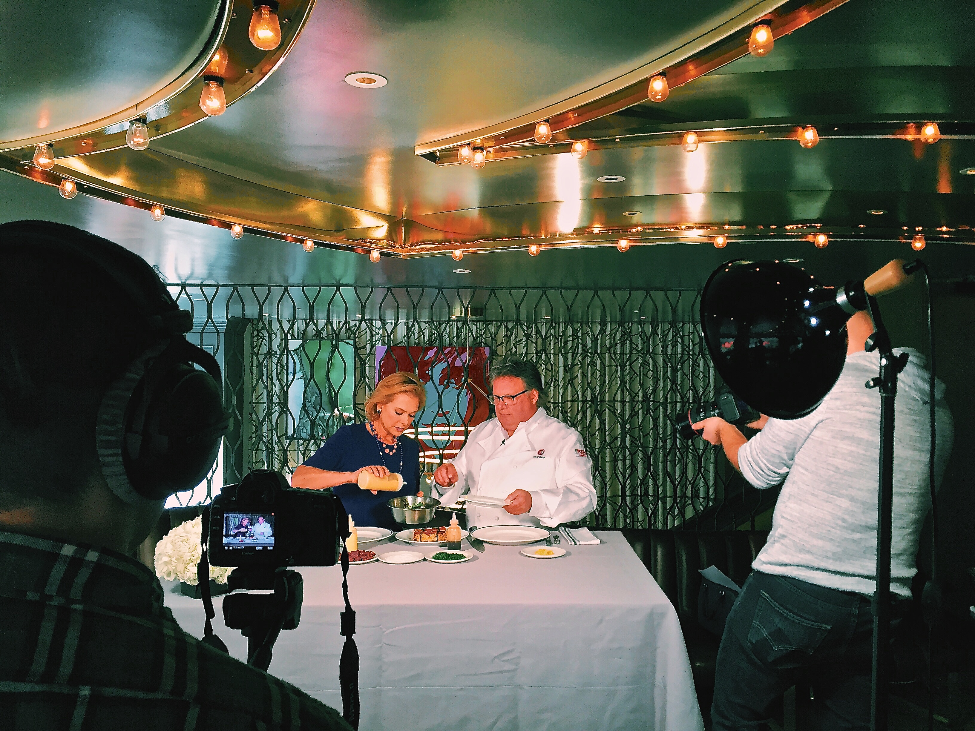 Behind the Scene shot of Pamela and Chef David Burke Cooking